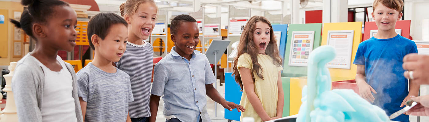 Children watching a science demonstration.