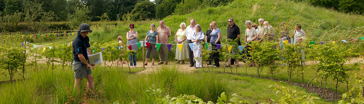 Members of the public taking part in a guided tour of Jodrell Bank grounds.